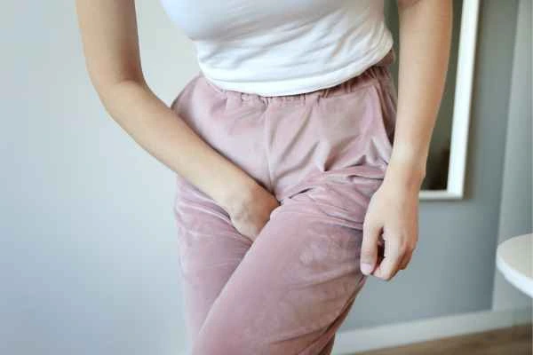 woman running for the toilet because of urinary incontinence Abbots Langley